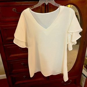 White V-neck flutter sleeve top. Purchased from Pink Lily Boutique. Size small.